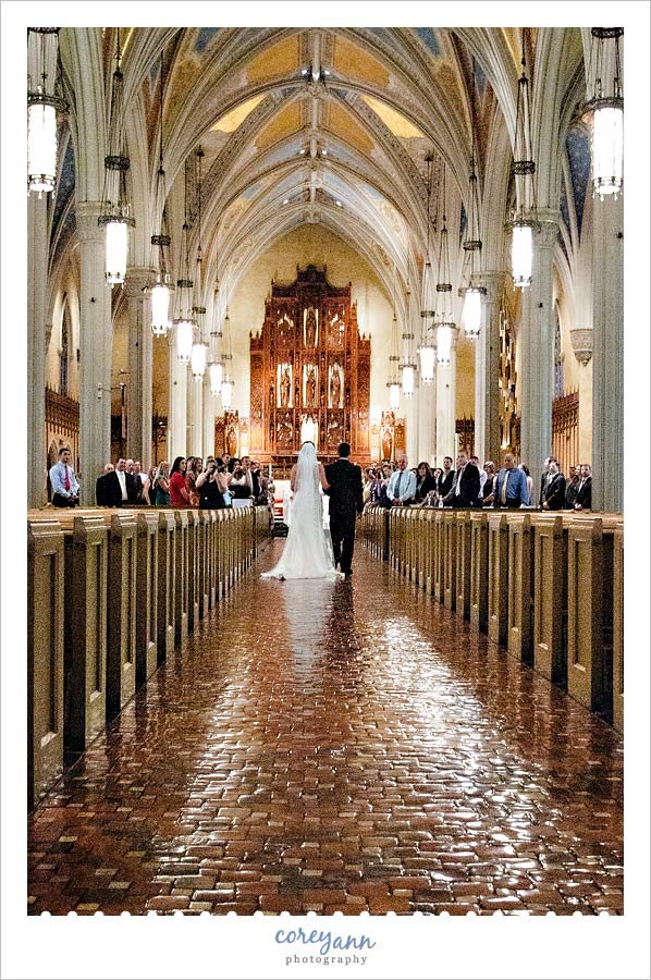 Rebecca's Brides Talk bride walking down the aisle at st john the evangelist in cleveland ohio