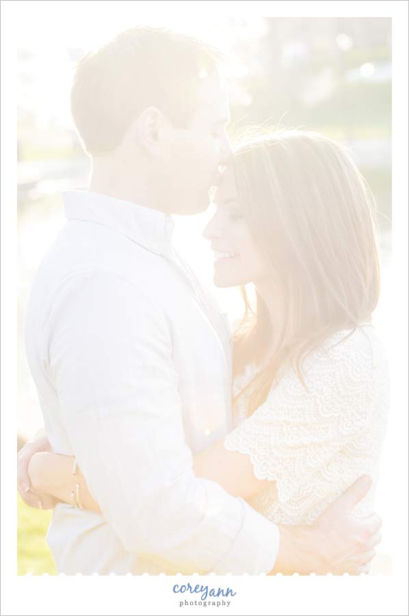 kissing on the forehead during engagement session