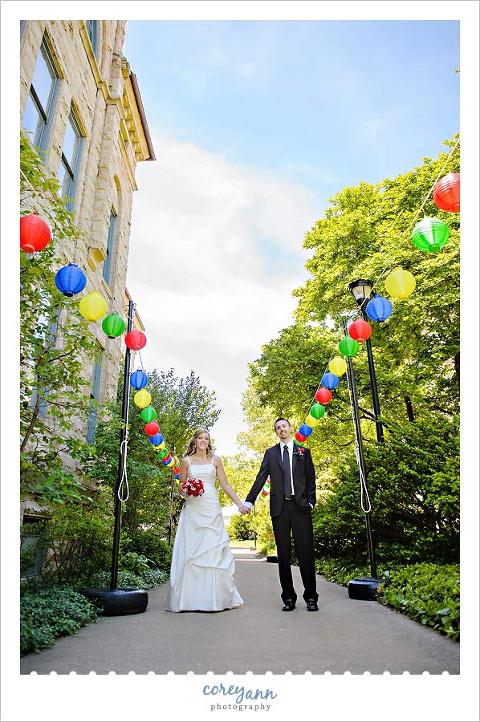 bride and groom with multi colored lanterns