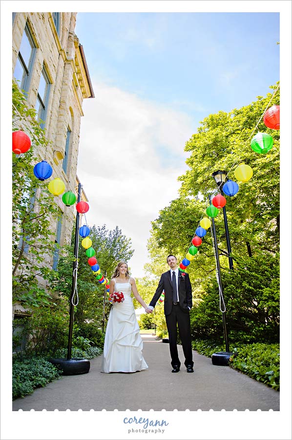 bride and groom with multi colored lanterns