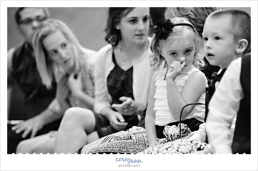 flower girl picking her nose at wedding ceremony