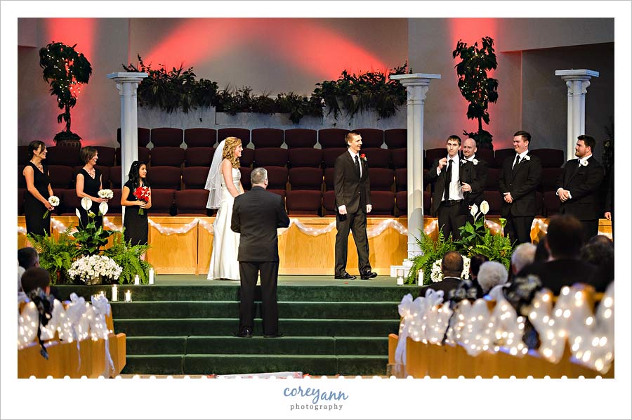 best man giving wedding rings