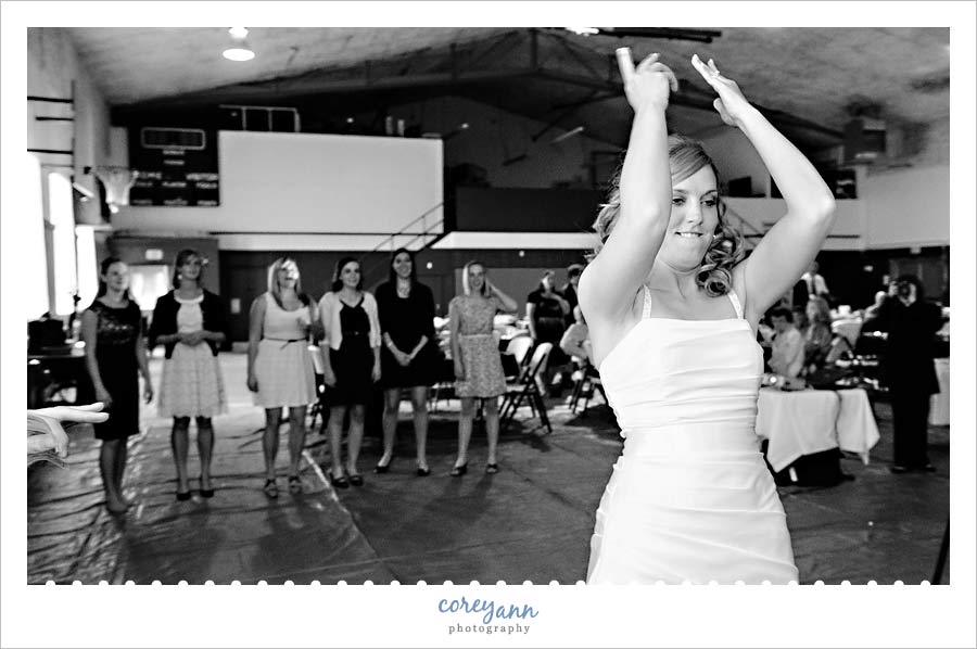 bride throwing her bouquet