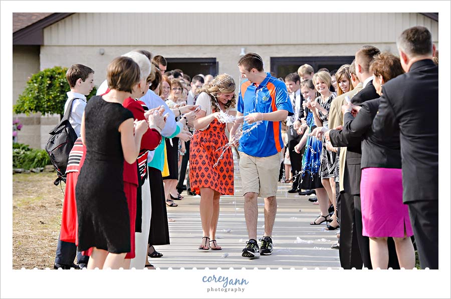 bride and groom exiting from wedding reception at first baptist church