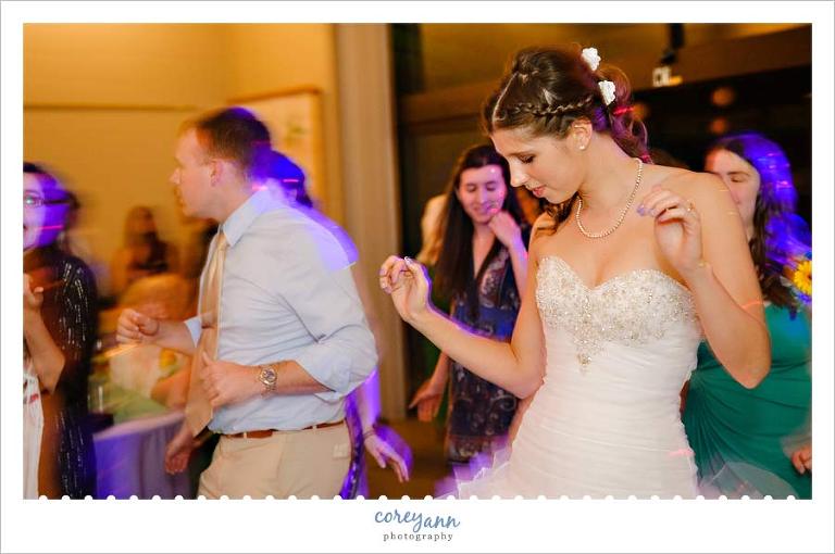 bride dancing on dance floor during wedding reception