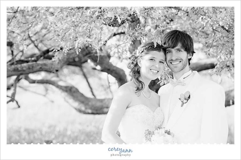 bride and groom in the butterfly garden at holden arboretum