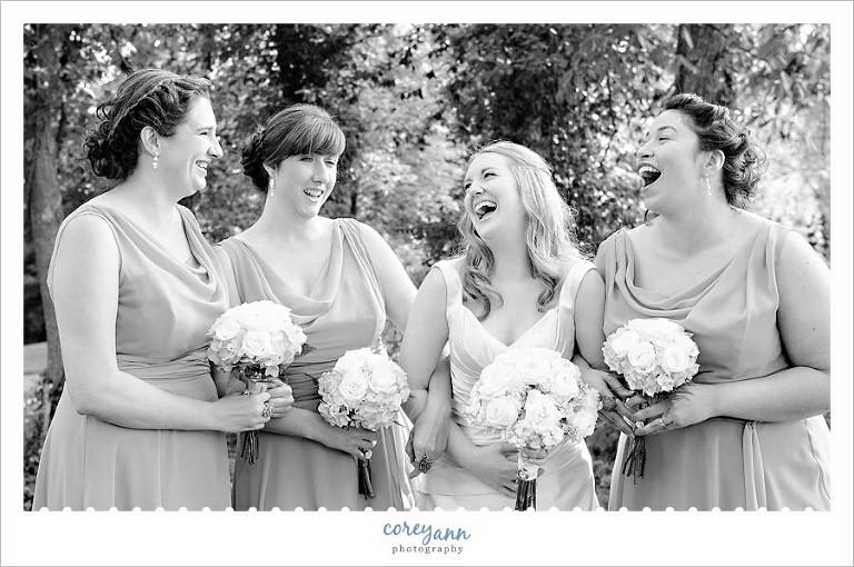 bride laughing with bridesmaids at gervasi vineyard