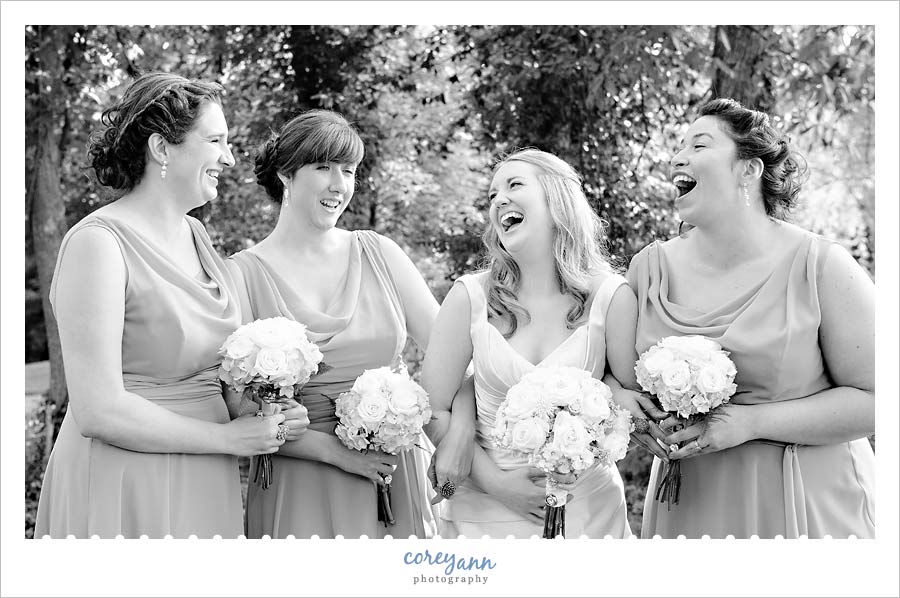 bride laughing with bridesmaids at gervasi vineyard