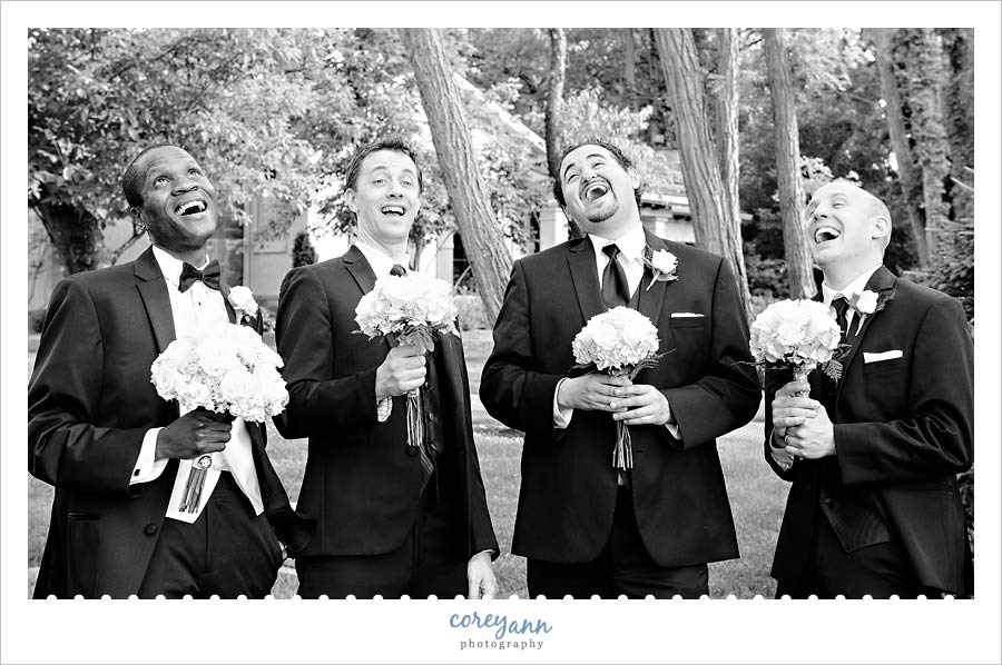 groom and groomsman mimicing the bridesmaids