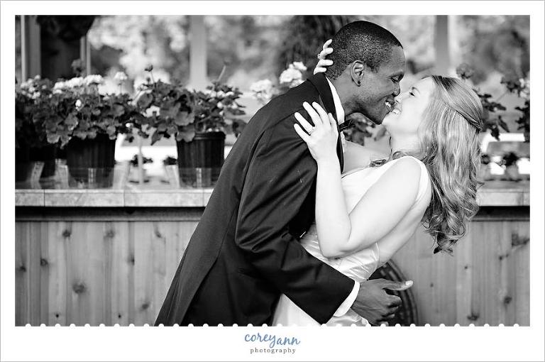bride and groom kissing in gazebo at gervasi vineyard