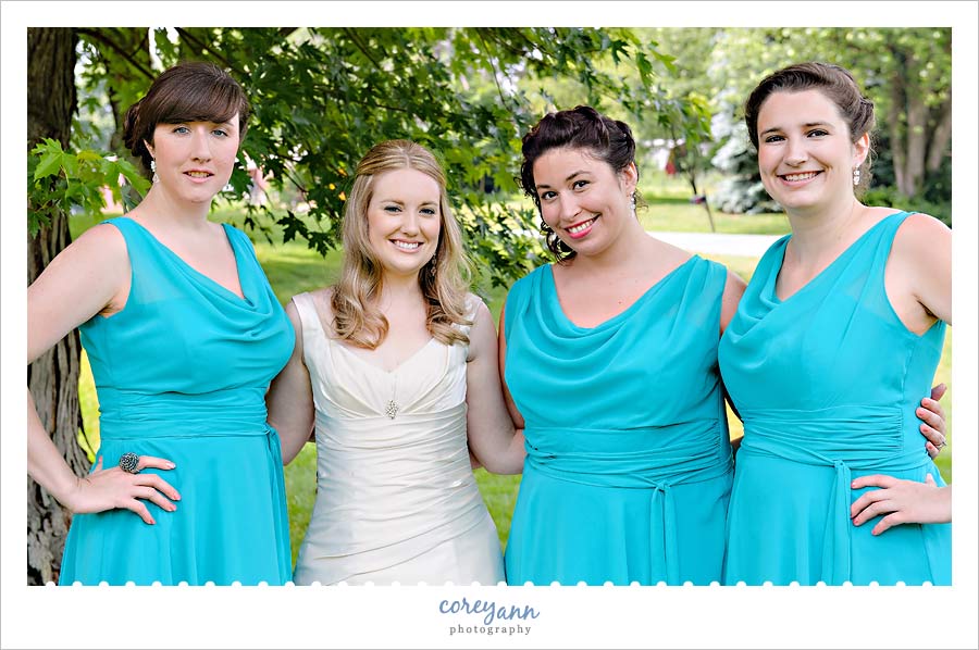 bride and bridesmaids in teal dresses