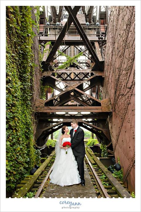 wedding portrait with bride and groom underneath bridge in cleveland