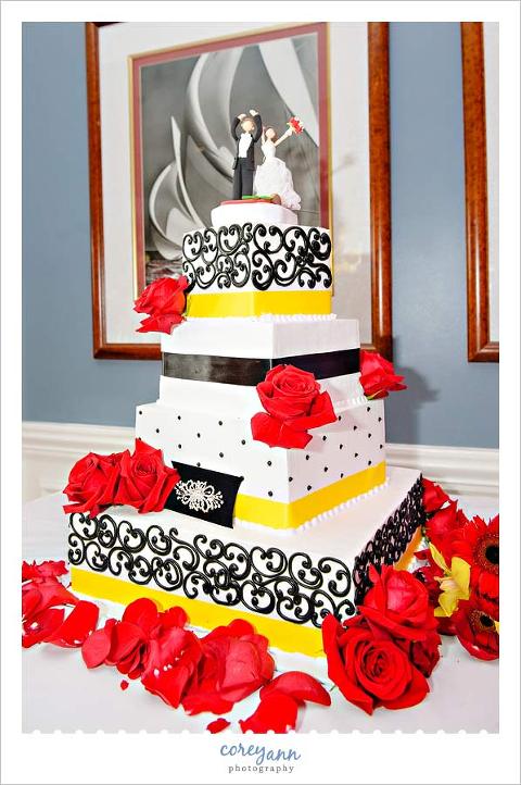 red and yellow wedding cake by wild flour bakery