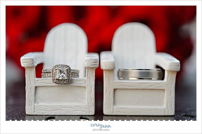 wedding rings on miniature chairs