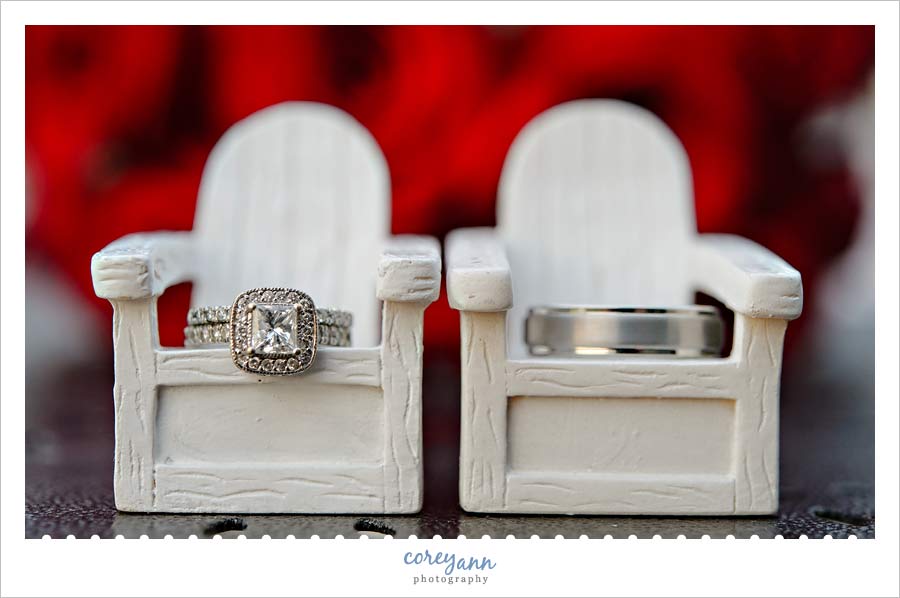 wedding rings on miniature chairs