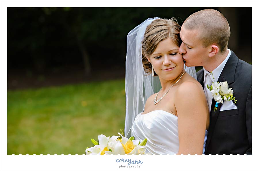 Kathleen and Derek's Canton Wedding groom kissing bride on cheek