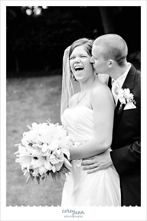 bride and groom laughing after wedding