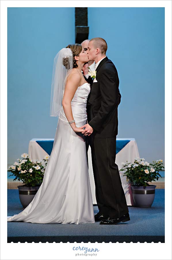 Kathleen and Derek's Canton Wedding first kiss during wedding in canton ohio