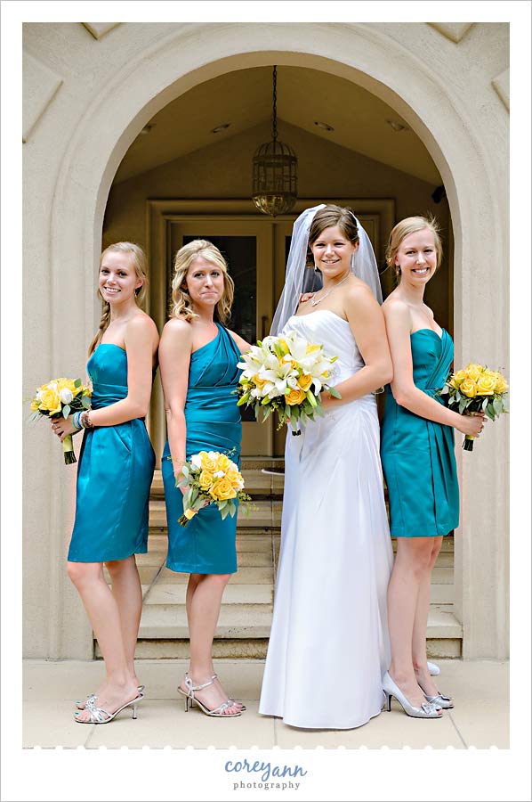 Kathleen and Derek's Canton Wedding bridesmaids in teal dresses with yellow bouquets