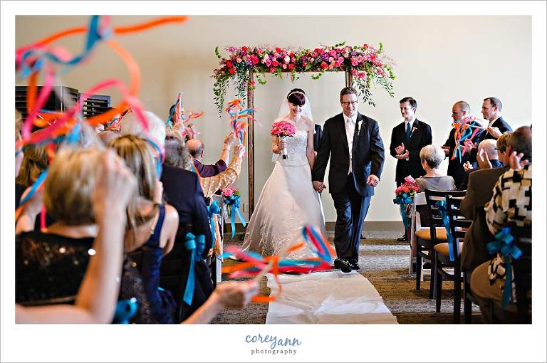 guests waving wands after unplugged wedding ceremony