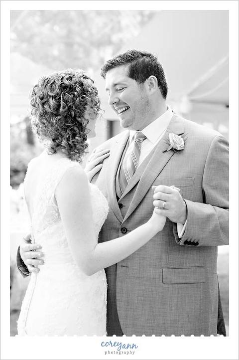bride and groom first dance beneath a tent in ohio