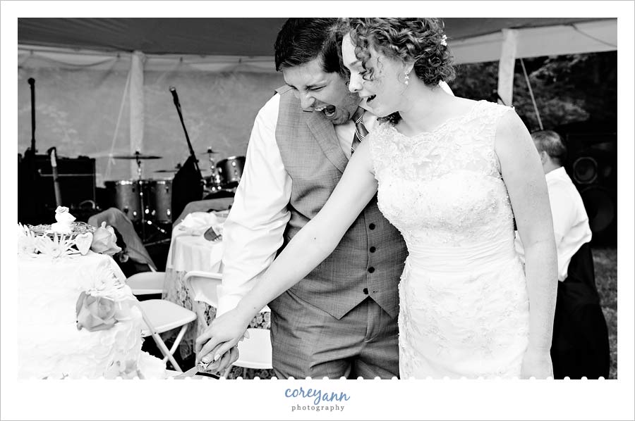 bride and groom cutting the wedding cake from raised & glazed