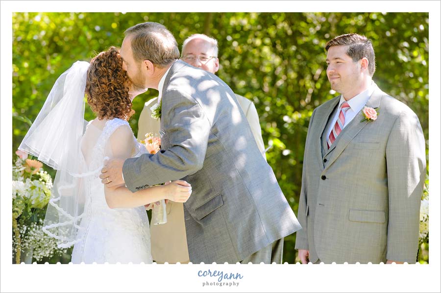 bride's father giving her away at wedding ceremony in ohio