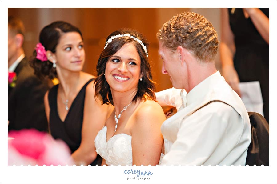 bride and groom exchanging a look during toasts