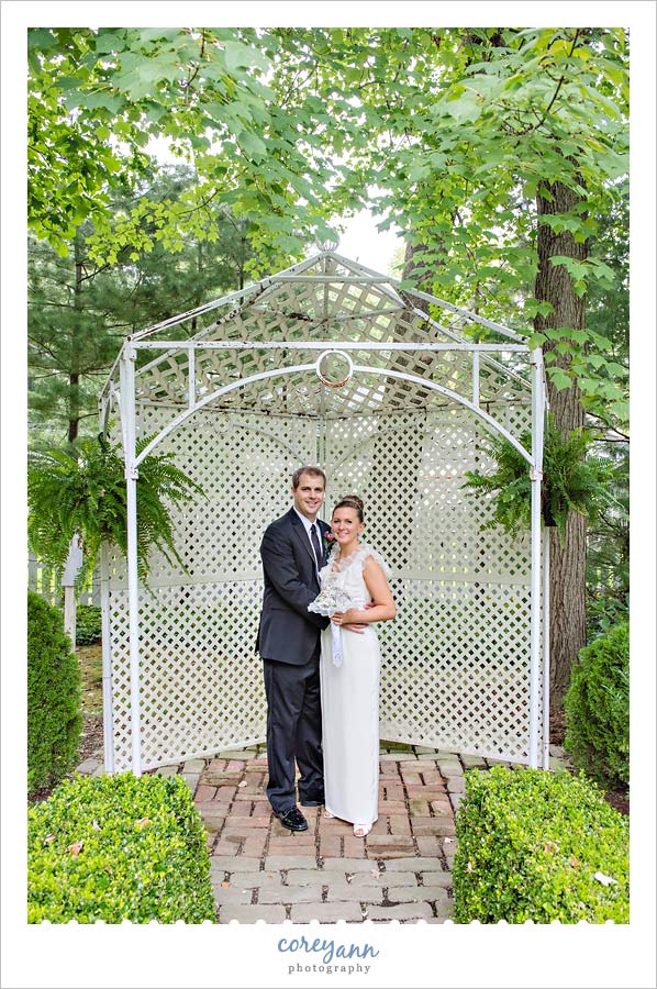 bride and groom wedding portrait in backyard of parents home