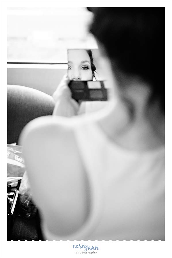 bride looking at makeup by jason kelly