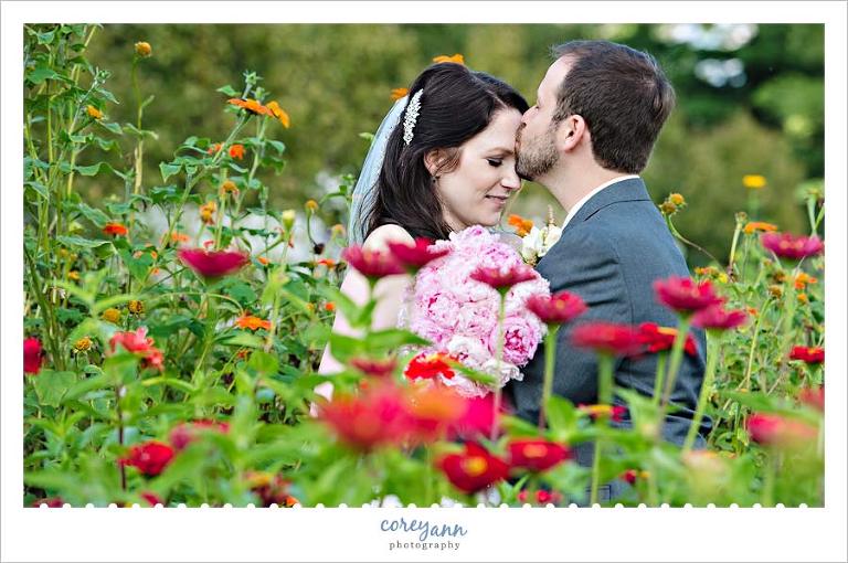 bride and groom portrait in flower garden