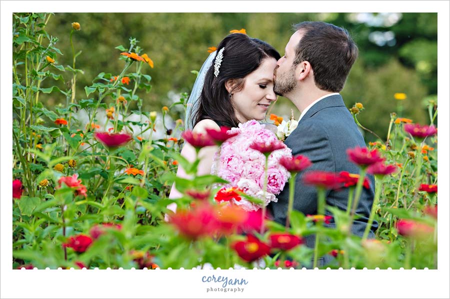 bride and groom portrait in flower garden