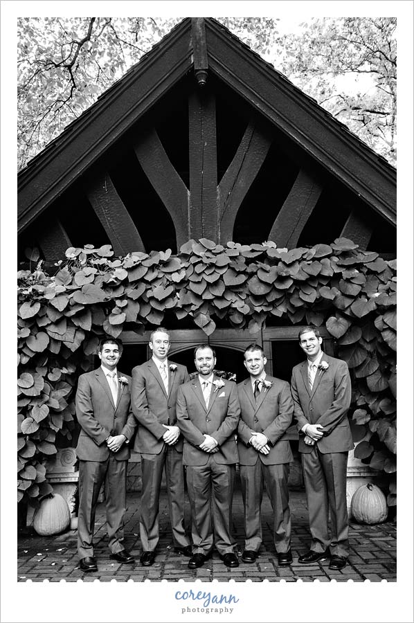 groomsman portrait in the english garden at stan hywet