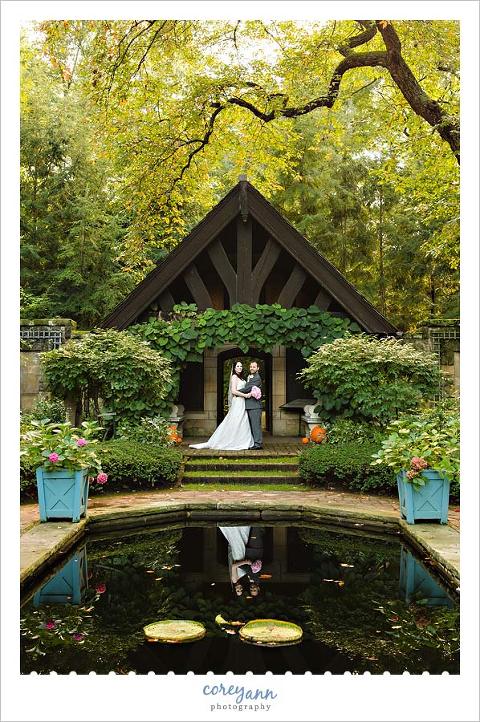bride and groom wedding portrait in the english garden at stan hywet