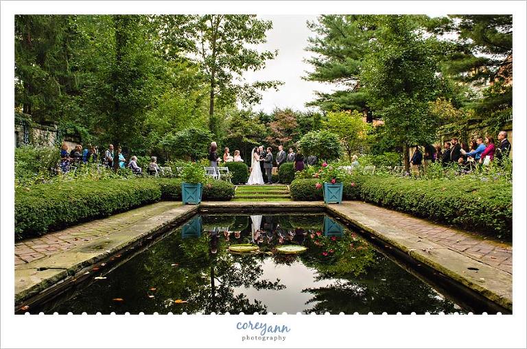 wedding ceremony in the english garden at stan hywet in september