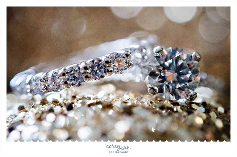 detail image of wedding rings on glitter shoes