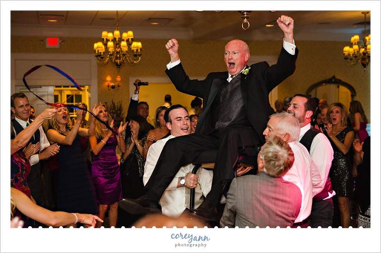 father of groom in chair during the hora in ohio