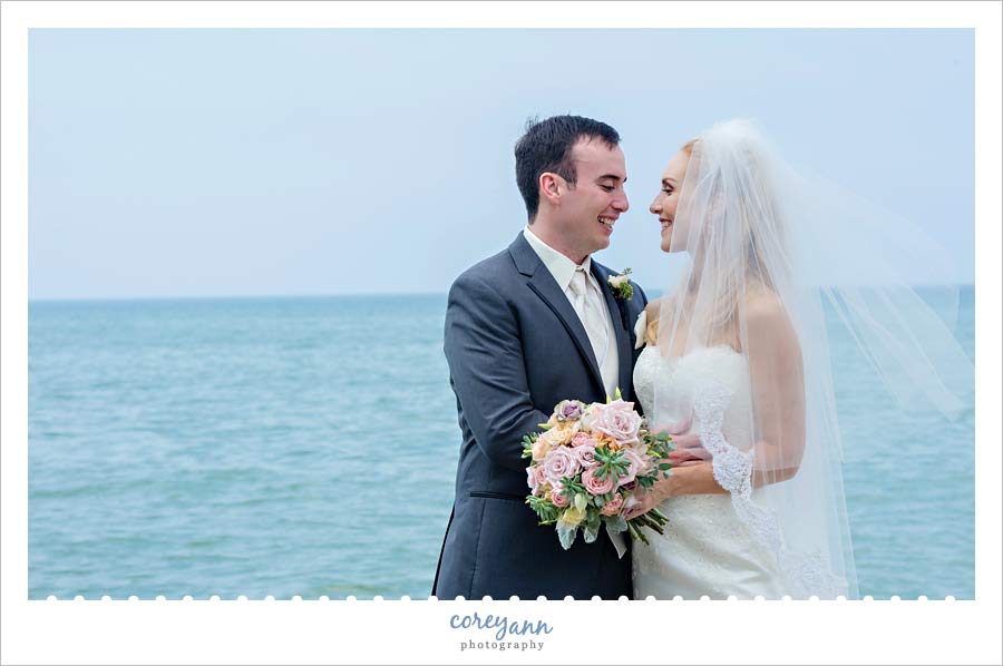 bride and groom wedding portrait on lake erie