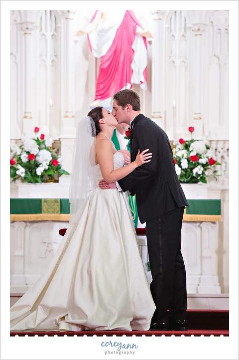 first kiss during wedding ceremony at st johns in port clinton 
