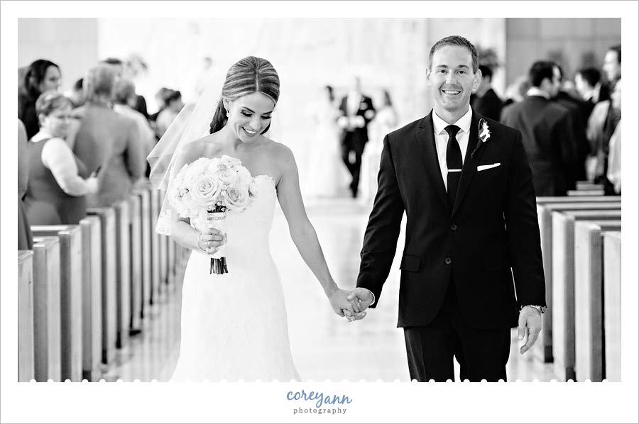 bride and groom recessing down the aisle after ceremony in university heights in ohio