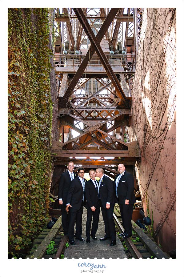 groomsman on jack knife bridge after wedding in cleveland