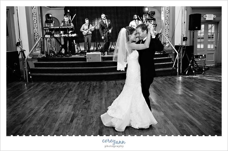 bride and groom dancing while swagg band plays