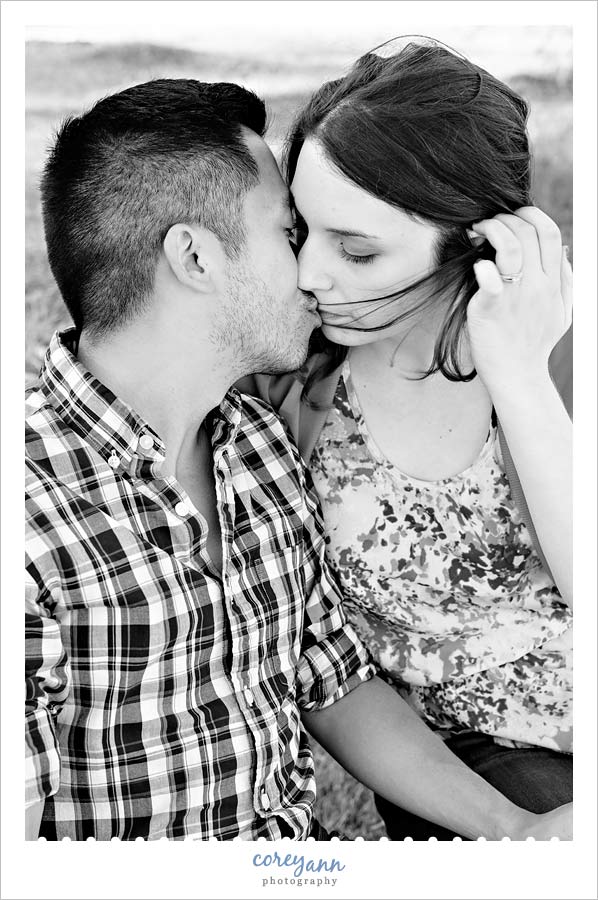 black and white kissing engagement portrait