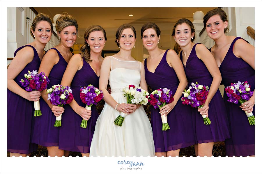 purple bouquets with purple bridesmaid gowns