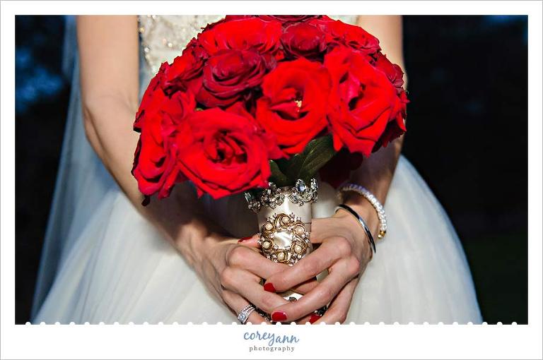 red and gold bridal bouquet by something new florist
