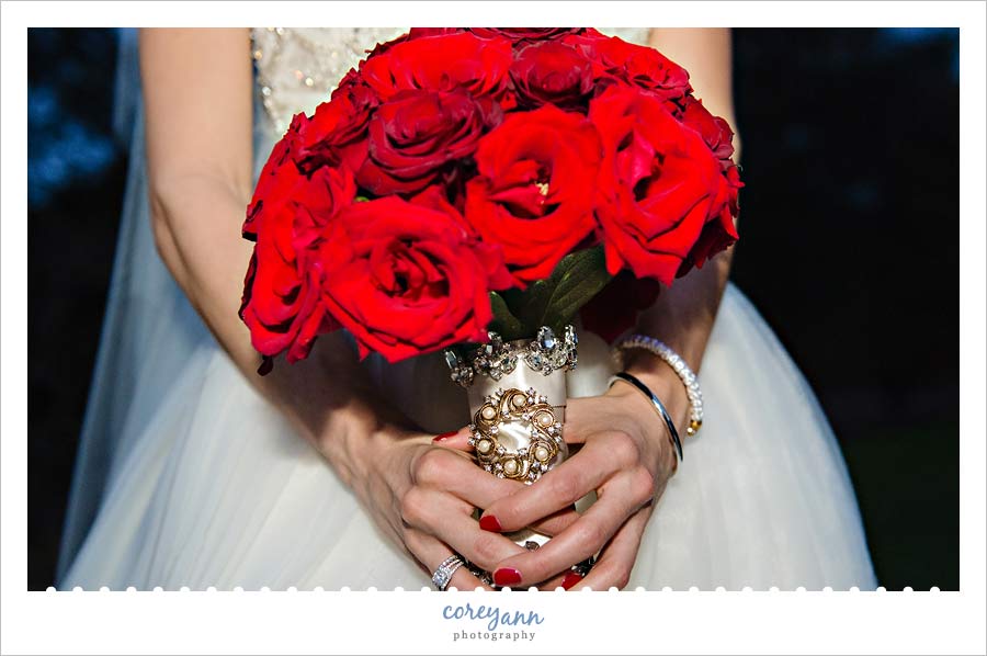 red and gold bridal bouquet by something new florist