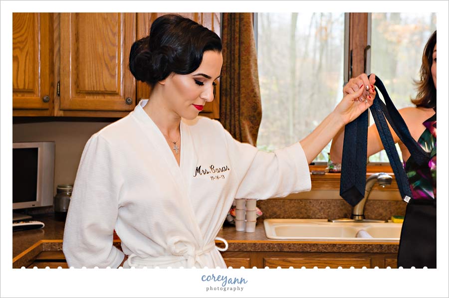 bride in custom bridal robe dancing before getting ready