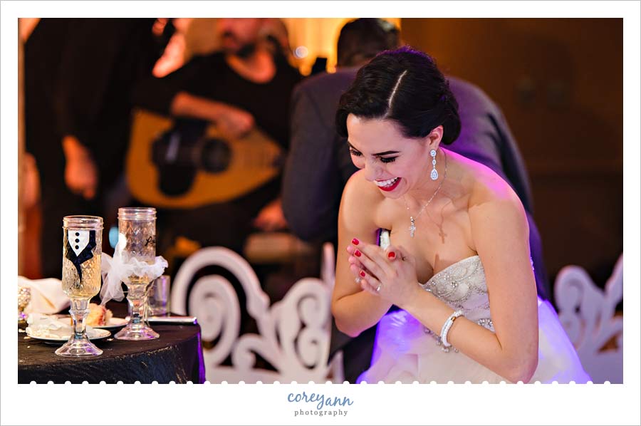 bride and groom laughing during toasts