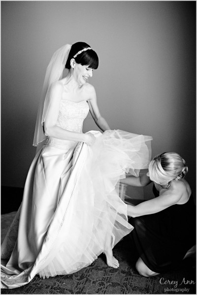 bride's sister helping her get ready