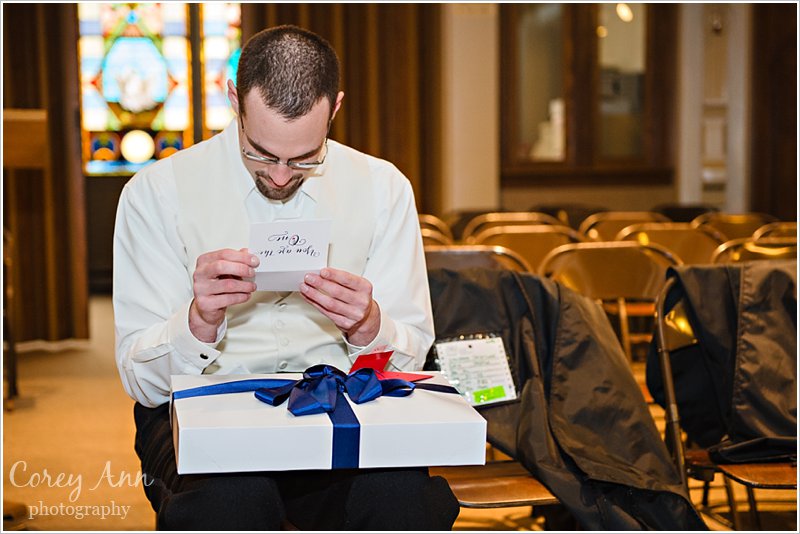 groom opening wedding gift from bride in ohio
